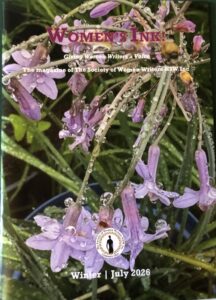 Close-up of purple lavender flowers with water droplets on the petals and green stems.