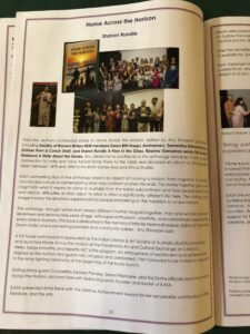 Open magazine page viewed upside down, with a purple border and a large block of text above a row of small photos at the bottom. The page includes a photo collage and a header that appears upside down.